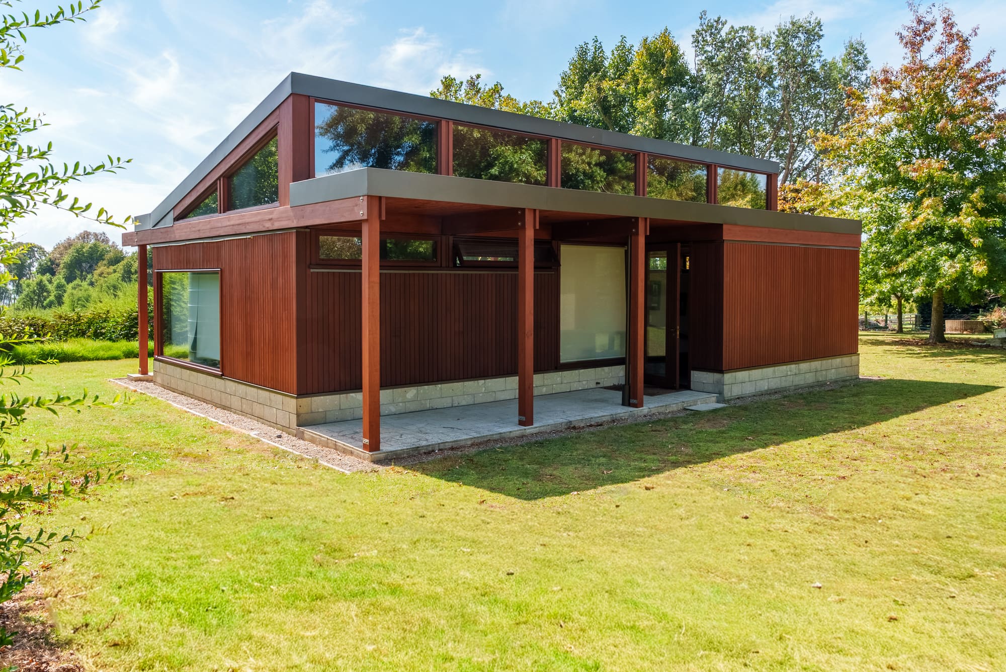 The timber elevation of a modern pavilion with clerestory glazing.